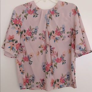 Open back with a tie floral blouse